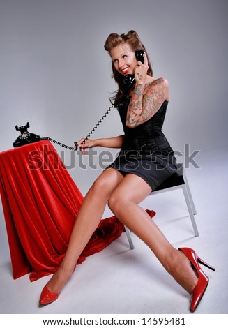 stock photo Rockabilly Girl in Pin up pose Fashion talking on the 