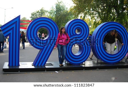 MOSCOW, RUSSIA - SEPTEMBER 01: People in Gorky park near 1980 number sign in conjunction with with Moscow 865th birthday on September 01, 2012 in Moscow, Russia.