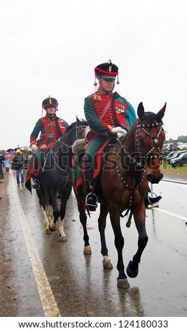 MOSCOW REGION - SEPTEMBER 02: Unknown soldiers in vintage uniform riding horses. Borodino historical reenactment battle at its 200 anniversary. September 02, 2012 in Borodino, Moscow Region, Russia.