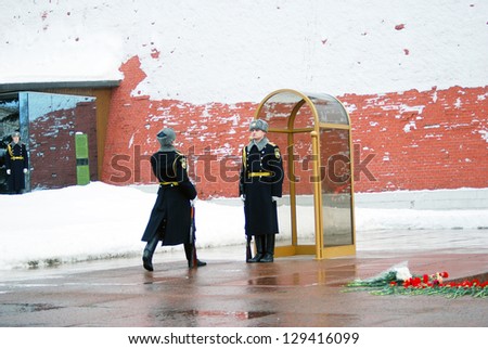 MOSCOW - FEBRUARY 2: A Guard of Honor walks during a shift change at the tomb of the Unknown Soldier at the wall of Moscow Kremlin on February 2, 2013 in Moscow, Russia.