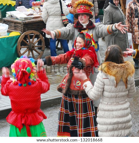 MOSCOW, RUSSIA - MARCH 16: People dancing on the street. There are street actors wearing Russian national clothes. Shrovetide celebration in Moscow city. Taken on March 16, 2013 in Moscow, Russia.