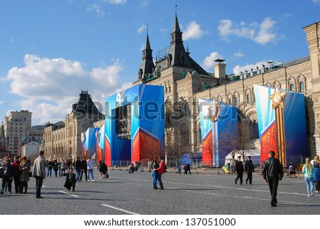 MOSCOW, RUSSIA - MAY 01: People walking on the Red Square decorated for a holiday. Spring and Labor Day celebration on May 01, 2013 in Moscow, Russia.