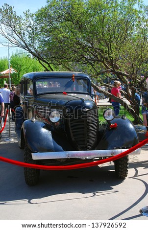 MOSCOW, RUSSIA - MAY 09: Vintage car GAZ-M-1. Holiday decoration in the Gorky park. Victory Day celebration on May 09, 2013 in Moscow.