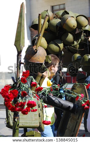 MOSCOW, RUSSIA - MAY 09: Victory day installation made of soldiers\' helmets and live red tulips placed on Kamergersky lane in Moscow city center. Victory Day celebration on May 09, 2013 in Moscow.