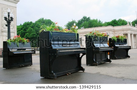 MOSCOW, RUSSIA - MAY 22: Pianos put by the entrance to the Gorky park. This is decoration of International Chereshnevy Les (Cherry Forest) Open-Art Festival held here. Taken on May 22, 2013 in Moscow.