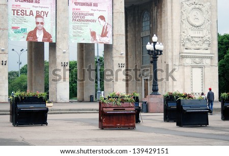 MOSCOW, RUSSIA - MAY 22: Pianos put by the entrance to the Gorky park. This is decoration of International Chereshnevy Les (Cherry Forest) Open-Art Festival held here. Taken on May 22, 2013 in Moscow.