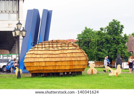 MOSCOW, RUSSIA - MAY 25: A small wooden house in the park. Outdoors exposition of MICRODOM - XV architectural festival GORODA. Location: Park of arts Muzeon, Moscow. Taken on May 25, 2013 in Moscow.