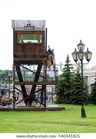 MOSCOW, RUSSIA - MAY 25: A small wooden house in the park. Outdoors exposition of MICRODOM - XV architectural festival GORODA. Location: Park of arts Ã¢Â?Â?MuzeonÃ¢Â?Â?, Moscow. Taken on May 25, 2013 in Moscow.
