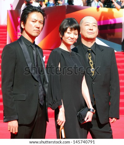 MOSCOW-JUNE 29: Japanese actor Shima Onisi, actress Yoko Maki, film director Tatsushi Omori (left to right) at 35 Moscow International Film Festival closing ceremony. Taken on June 29, 2013 in Moscow.