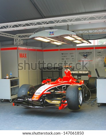 MOSCOW - JULY 20: Marussia F1 sport car at Moscow City Racing. Formula 1 teams show in historical city center of Moscow. Taken on July 20, 2013 in Moscow, Russia.