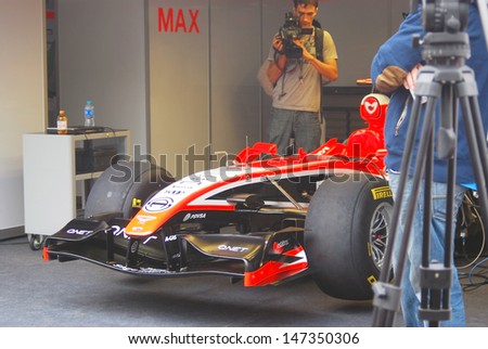 MOSCOW - JULY 20: Marussia F1 sport car at Moscow City Racing. Formula 1 teams show in historical city center of Moscow. Taken on July 20, 2013 in Moscow, Russia.