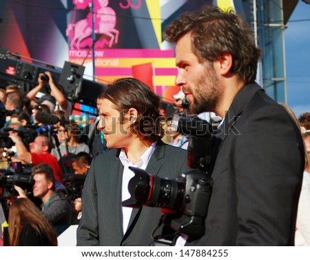 MOSCOW - JUNE 20: Jeremy Kleiner (at left), a film producer, at 35 Moscow International Film Festival red carpet opening. He presents his recent movie World War Z. Taken on June 20, 2013 in Moscow.