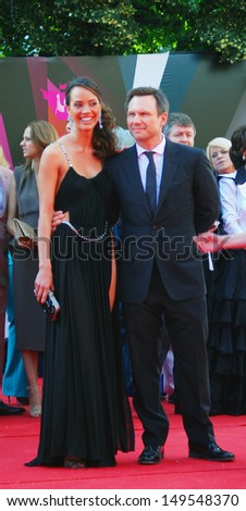 MOSCOW - JUNE 20: Sofia Arzhakovskaya and Christian Slater at XXXV Moscow International Film Festival red carpet opening ceremony. Taken on June 20, 2013 in Moscow, Russia.