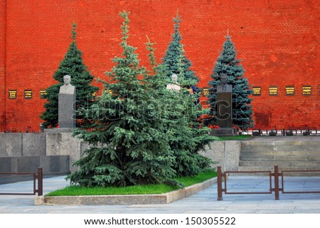 MOSCOW - JULY 23: Monuments to famous people by the Kremlin wall, near the Lenin\'s mausoleum on the Red Square, Moscow, Russia. Popular touristic landmark. Taken on July 23, 2013 in Moscow.