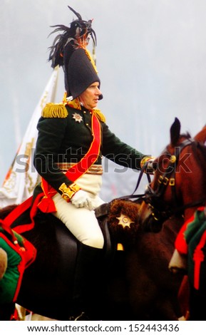 MOSCOW REGION - SEPTEMBER 02: A reenactor dressed as Napoleonic war soldier rides a horse on September 02, 2012 in Borodino, Moscow Region, Russia. He reenacts the Borodino battle held in 1812.