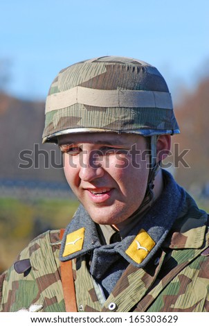 MOSCOW REGION - OCTOBER 13: Portrait of a reenactor dressed as WW II soldier on October 13, 2013 in Borodino, Moscow Region, Russia. The battle he is reenacting was the Moscow Battle held in 1941.