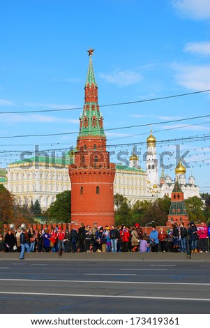 MOSCOW - OCTOBER 06, 2013: Many people stand on the Big Stone bridge and greet Olympic flame arrival to Moscow, preparation to Sochi-2014 Olympic games.