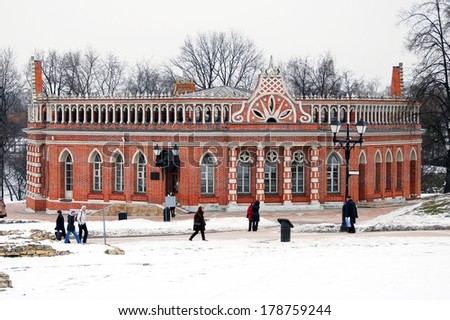 MOSCOW - FEBRUARY 22, 2014: Architecture of Tsaritsyno park in Moscow, Russia, in winter. People walk by the old building.  A popular touristic landmark in Moscow.