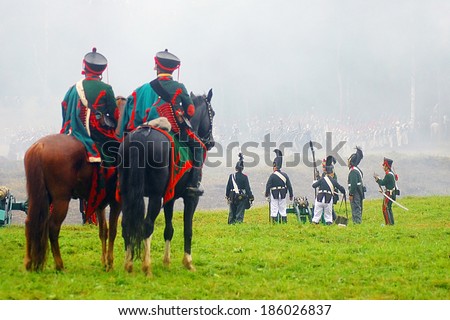 MOSCOW REGION, RUSSIA - SEPTEMBER 02, 2012: Reenactors dressed as Napoleonic war soldiers fight on the battlefield. The battle they are reenacting was the Borodino battle held in 1812.