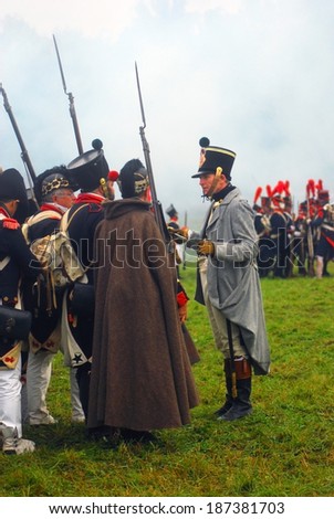 MOSCOW REGION, RUSSIA - SEPTEMBER 02, 2012: Reenactors dressed as Napoleonic war soldiers fight on the battlefield. The battle they are reenacting was the Borodino battle held in 1812.