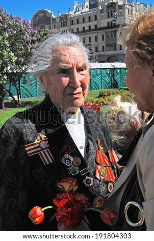 MOSCOW - MAY 09, 2014: Senior veteran woman portrait. Victory Day celebration in Moscow.