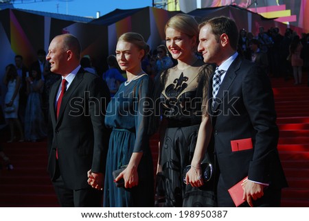 MOSCOW - JUNE 20, 2013: right to left - film director Rezo Geginieshvily, actresses Nadezhda Mikhalkova and Oxana Akinshina at XXXV Moscow International Film Festival red carpet opening ceremony.