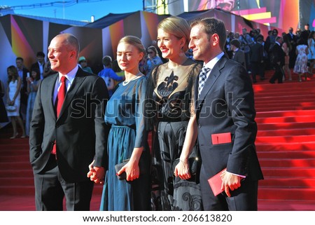 MOSCOW - JUNE 20, 2013: right to left - film director Rezo Geginieshvily, actresses Nadezhda Mikhalkova and Oxana Akinshina at XXXV Moscow International Film Festival red carpet opening ceremony.