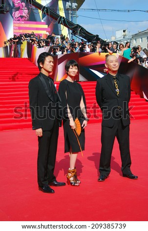 MOSCOW - JUNE 29, 2013: Japanese actor Shima Onisi, actress Yoko Maki, film director Tatsushi Omori (left to right) at 35 Moscow International Film Festival closing ceremony.