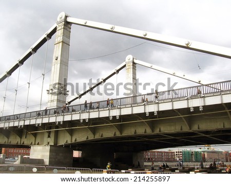 MOSCOW - AUGUST 31, 2014: View of the Crimean (Krymsky) bridge in Moscow from the Gorky park, a popular touristic landmark and place for walking in Moscow.