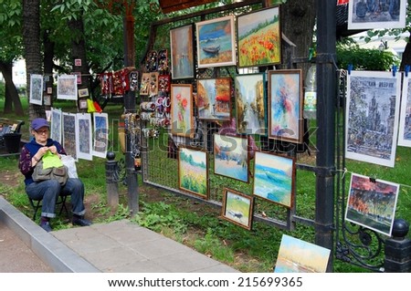 MOSCOW - SEPTEMBER 06, 2014: A souvenir seller portrait. Moscow City Day celebration in Moscow city center.