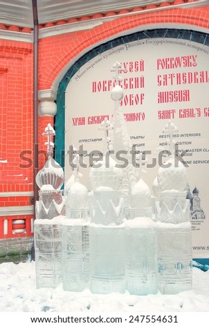 MOSCOW - FEBRUARY 02, 2013: Ice Sculpture exhibition on the Red Square, by the St. Basil\'s Cathedral. The sculpture shows the Saint Basils church made of ice.