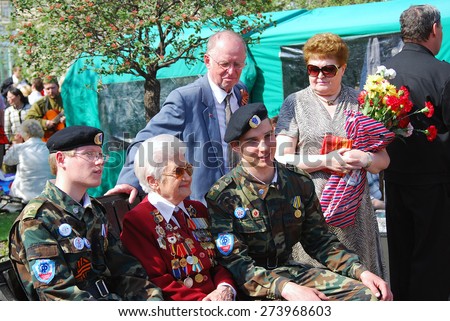 MOSCOW, RUSSIA - MAY 09: A war veteran holding flowers. Victory Day celebration on May 09, 2013 in Moscow.