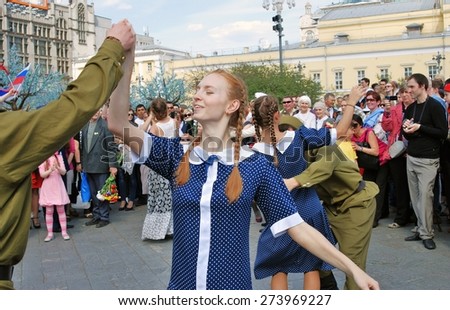 MOSCOW, RUSSIA - MAY 09: Young actors dressed as army soldiers performing on the Theater Square, by the Bolshoi Theater. Victory Day celebration on May 09, 2013 in Moscow.