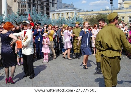 MOSCOW, RUSSIA - MAY 09: Young actors dressed as army soldiers performing on the Theater Square, by the Bolshoi Theater. Victory Day celebration on May 09, 2013 in Moscow.