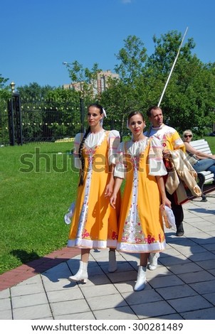 MOSCOW - JULY 26, 2015: Women in traditional Russian dresses in Tsaritsyno park in Moscow. Tsaritsyno is a popular touristic landmark.