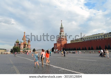MOSCOW - JULY 29, 2015: View of the Red Square in Moscow, Russia. Tourists walk on the Square. UNESCO World Heritage Site.