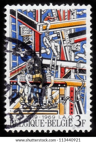 BELGIUM - CIRCA 1969: A stamp printed in Belgium shows workers erecting building structures, dedicated to 50 year International Labour Organisation - IAO, circa 1969