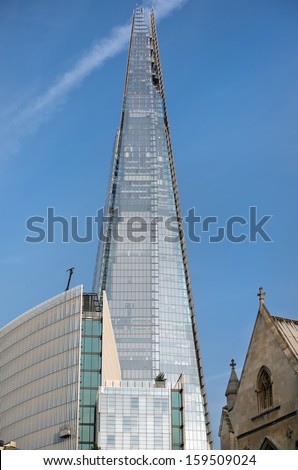 LONDON - July 15 : The glass Shard building at london bridge, just over 2 years old is the tallest building in europe at over 1,000 feet (310 metres) , on July 15, 2013 in London, UK.