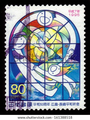 JAPAN - CIRCA 1995: stamp printed by Japan shows children holding hands behind stained glass window, peace dove, earth from space, circa 1995