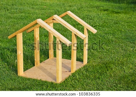 Building small dog house with lumber, frame completed