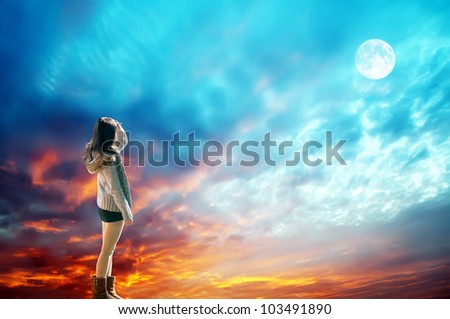 Romantic dreaming girl look at the moon