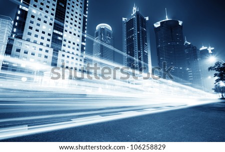 the light trails on the modern building background in shanghai china.