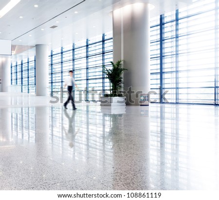 people silhouette in hall of office building