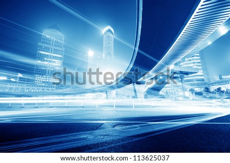 The Light Trails On The Modern Building Background In Shanghai China.