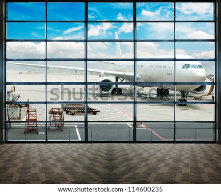 Parked Aircraft On Shanghai Airport Through The Gate Window.