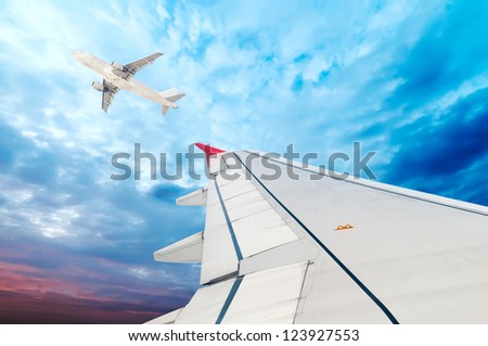 airplane wing, sky and clouds