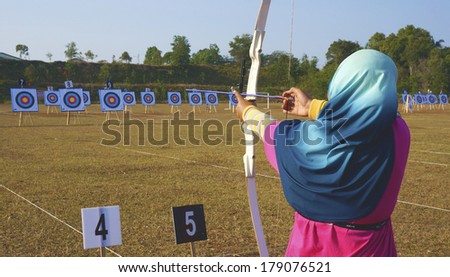 PAHANG, MALAYSIA - FEB 25: School Games,Unidentified archers female in action during the school Tournament February 25, 2014 in Kuantan Pahang, Malaysia.