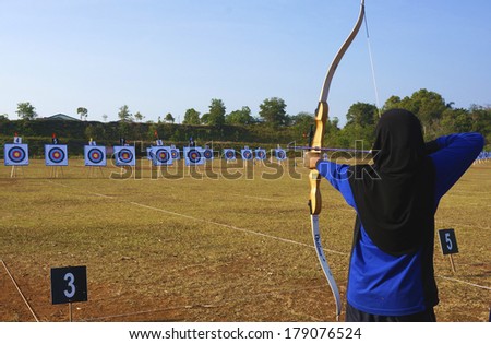 PAHANG, MALAYSIA - FEB 25: School Games,Unidentified archers female in action during the school Tournament February 25, 2014 in Kuantan Pahang, Malaysia.