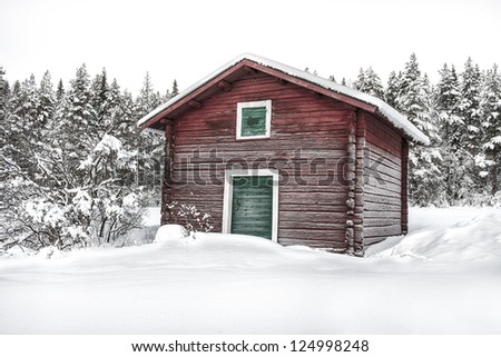 a lonely timber house in a cold remote rural setting