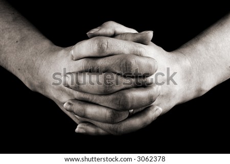 female hands clasped in prayer